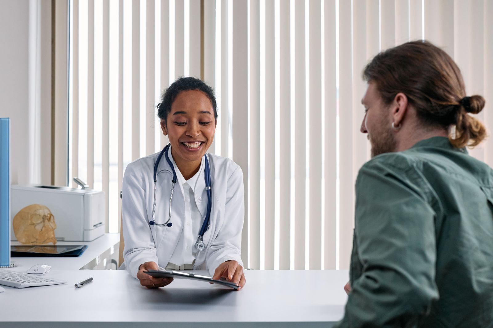 Doctor and patient consultation in a bright clinic